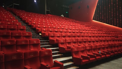 red plastic chairs inside stadium